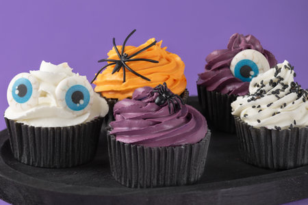 Halloween cupcakes with buttercream and holiday decoration. Halloween muffin. Halloween creative food.の写真素材