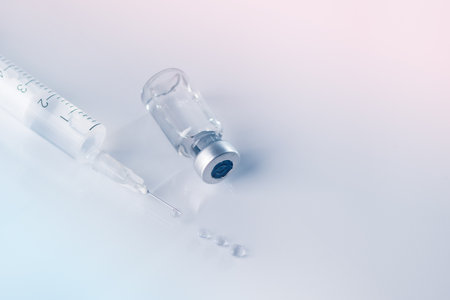 Glass vial and syringe with injection. Vaccination or beauty therapy concept.の写真素材