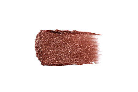 Wet bronzer, eye shadow smear isolated on white background. Bronze glittering eye shadow color swatch.の写真素材