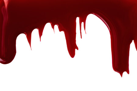 Burgundy nail polish drops flow down on white background. Red gel paint color dripping on the white.の写真素材