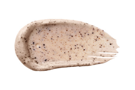 Face cream coffee scrub swatch isolated on white background. Cosmetic exfoliation product. Handmade coffee scrub for body care.の写真素材