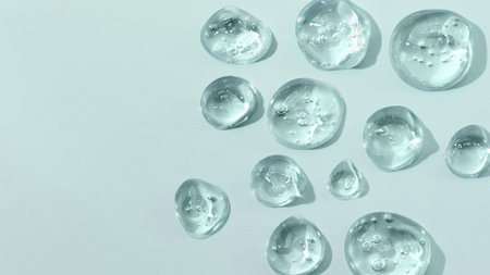 Drops of gel face serum top view. Abstract gel drops for design. Liquid gel moisturizer.の写真素材