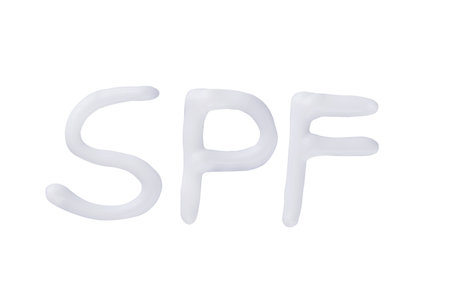 SPF cream. Sunscreen cream isolated on white background. Creative idea of suntan lotion cream. Sun UV protection concept.の写真素材