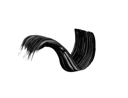 Black mascara brushstroke swatch isolated on white background. Cosmetic mascara smudged smear for design.の写真素材
