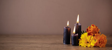 Day of the dead, Dia De Los Muertos greeting card. Creative Halloween composition with candles and marigold flowers. Day of dead background with copy space.の写真素材