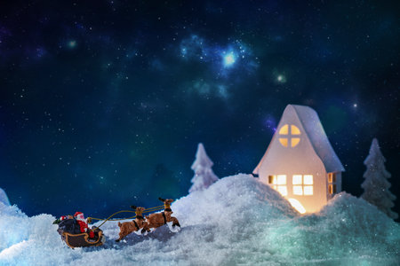 Christmas greeting card with Santa Claus ride on reindeer. Creative Christmas composition. Christmas background.の写真素材