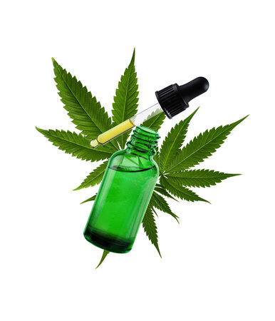 Dropper with cannabis oil and hemp leaf on white background. Hemp CBD oil in a bottle. Herbal cannabis face serum for skin care.の写真素材