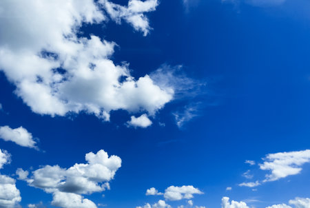 Bright blue sky background with clouds. Clear blue sky background for design.の写真素材