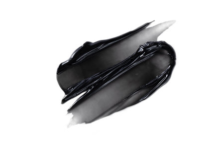 Charcoal toothpaste swatch isolated on white background. Black charcoal whitening toothpaste texture for design.の写真素材