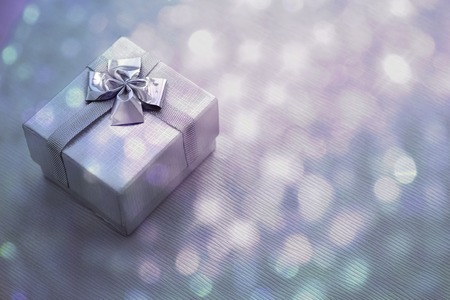 Gift box over bokeh background. Closeup. Copy spaceの写真素材