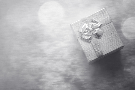 Gift box over bokeh background. Closeup. Copy spaceの写真素材