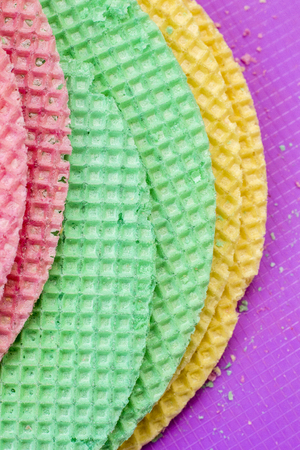 Colourfull waffles. Textured abstract background. Close up. Flat layの写真素材