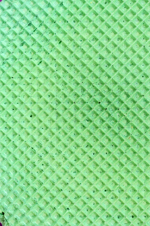 Textured abstract background. Colourfull green waffle. Close up. Flat layの写真素材