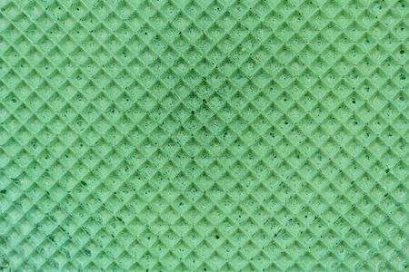 Textured abstract background. Colourfull green waffle. Close up. Flat layの写真素材