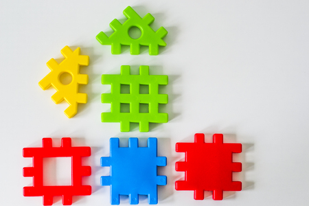 Colorful puzzle made from toys wait for fulfillment. Concept for complete or dream life. Real estate symbolの写真素材
