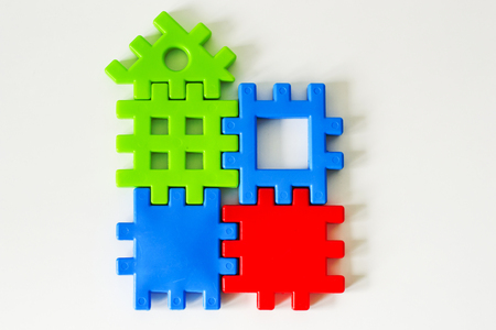 Colorful puzzle made from toys wait for fulfillment. Concept for complete or dream life. Real estate symbolの写真素材