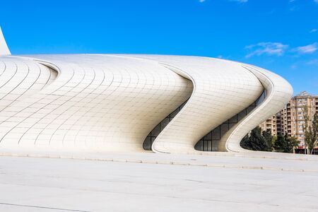 Baku, Azerbaijan, Novemver 07.2016: Close-up view of the Heydar Aliyev Center. White waves of walls in sunny weather and blue skyのeditorial素材