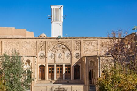 Kashan, Iran, Novemver 10.2016: Exterior of Boroujerdi historic house, now museum, built by a persian architect Ustad Ali Maryam. The white tower of traditional windcatcherのeditorial素材
