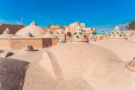Kashan, Iran, Novemver 10.2016: The roof of Sultan Amir Ahmad Bathhouse. The roof domes with blue glass decoration on the background of deep blue clear skyのeditorial素材