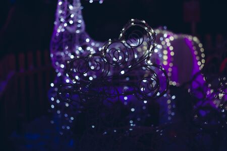 Christmas lights. Lights on a purple blurred background. Christmas and New Year backgroundの写真素材