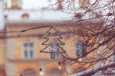 New Year and Christmas background. Christmas street decorations in snowfall. Garland on a background...
