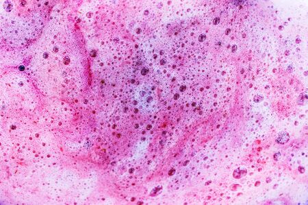 Abstract pink background of purple and white foam bubbles and flows