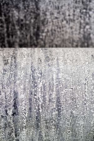 List of roofing felt close-up. Ruberoid texture. Grunge background of building material. Roof...