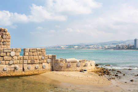 Panoramic view of the city of Sidon in Lebanon. Beautiful ruins of a stone wall of the Sea Castle by...