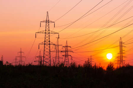 Electric power transmission lines. High voltage post. Industrial landscape. Electricity pylon at...
