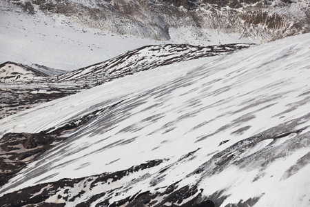 Snow-capped slopes. Winter mountains, alpine skiing. Sunny snowy landscape. Panoramic mountain view....