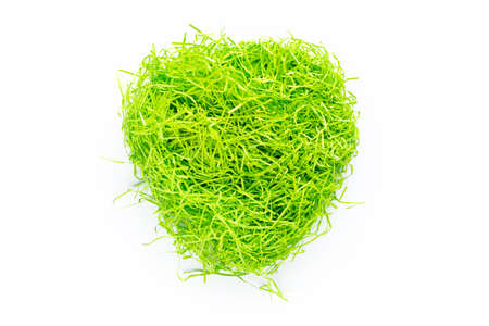 Shredded green paper packing material. Copy space. Light green spaghetti shredded packing paper....