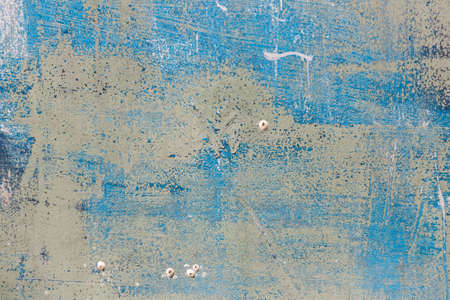 Old rust metal scratched surface. Abstract blue grunge background. Corrosion of metal. Blue and brown background with scratches and cracksの写真素材