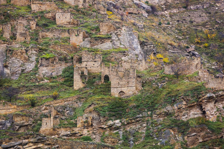 Old stone town Kakhib, Dagestan, Russia. Ancient towers, ruins and houses on the rocks. Panoramic view of the city on the mountainsの写真素材