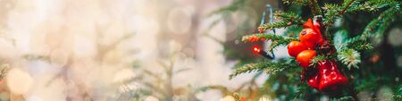 Decorated Christmas tree. Close up of Christmas decoration. Golden bokeh banner. Christmas background.の写真素材