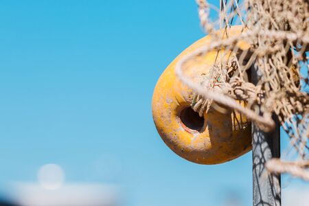 Marine backgroung. Buoy and rope. Blurry ship wievの写真素材