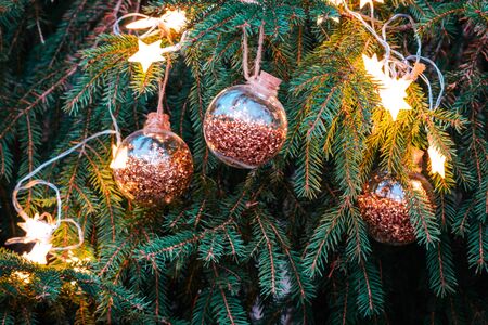 Beautiful Christmas tree with golden balls and blurred bokeh.の写真素材
