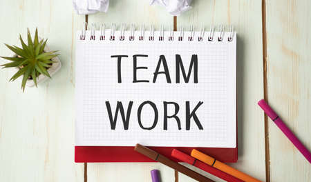 Team Work text in notepad with a business objects.の写真素材