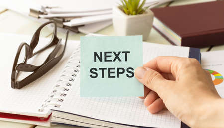 Next Steps card with colorful background with defocused lightsの写真素材