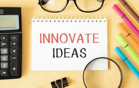 Innovate idea text on notepad with keyboard on table.の写真素材