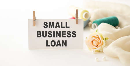SMALL BUSINESS LOAN, handwriting text on page. Copy space.の写真素材