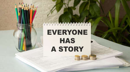 Everyone has a story concept Notepad, business conceptの写真素材