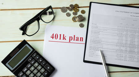 Retirement plan with glasses and calculator, document is mock-upの写真素材