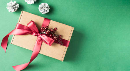 Christmas background with decorations and gift boxes on green backdropの写真素材