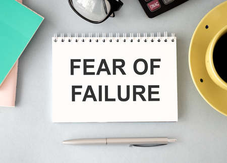 text fear of failure, isolated white background with printer and folders.business concept