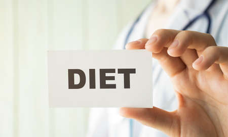 Doctor holding a card with text Diet, medical conceptの写真素材
