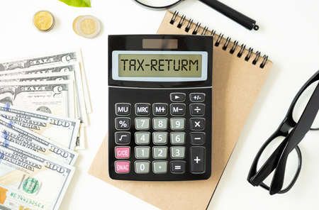 Word Tax Return on calculator. Business and tax concept. Top view.の写真素材