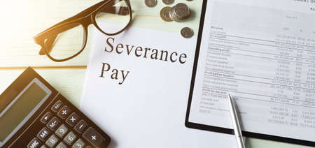 Paper with severance pay on a tableの写真素材