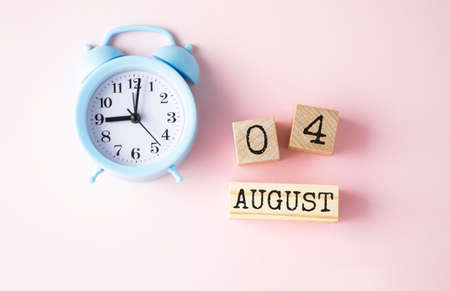 Wooden calendar August 04 on a white background.の写真素材