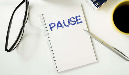 Pause written on a memo at the officeの写真素材