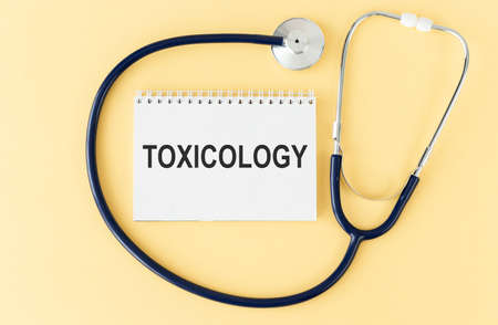 Toxicology on the Document with yellow background. Healthcare or Medical conceptの写真素材